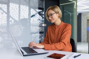 Image of female working on computer in office